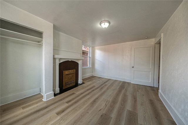 unfurnished living room featuring light hardwood / wood-style flooring