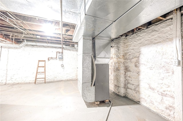 basement featuring heating unit