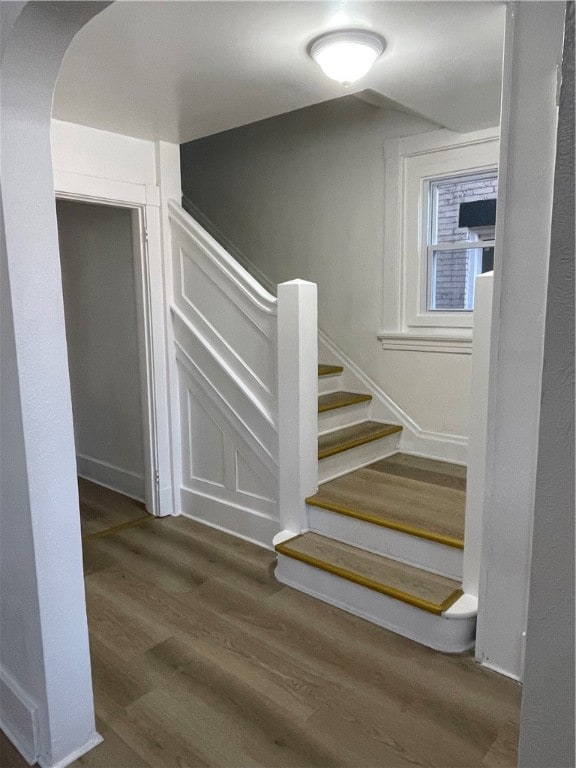 staircase featuring hardwood / wood-style flooring