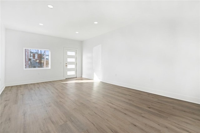 spare room with light hardwood / wood-style floors