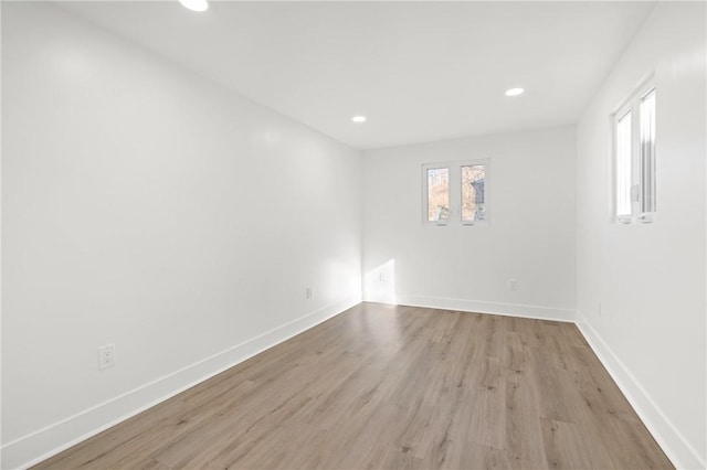 spare room with light hardwood / wood-style floors