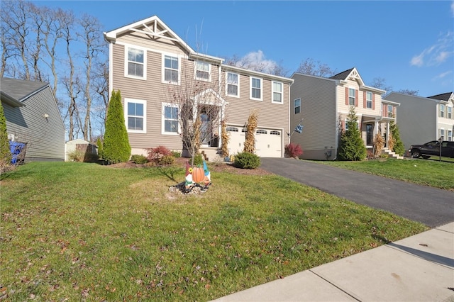 view of front of house with a garage and a front yard