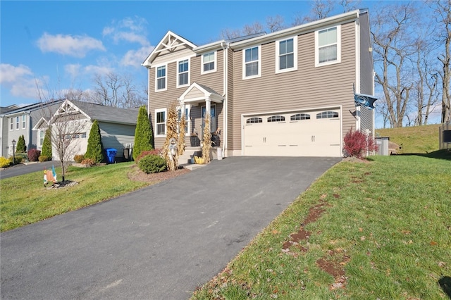 view of front of property with a garage and a front lawn