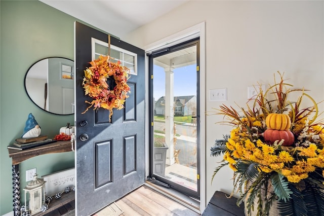 doorway to outside with hardwood / wood-style flooring