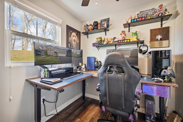 home office with dark hardwood / wood-style floors and ceiling fan