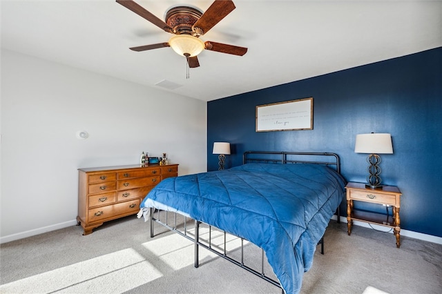 bedroom featuring light carpet and ceiling fan