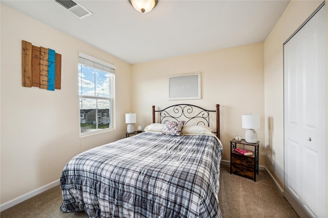 carpeted bedroom featuring a closet