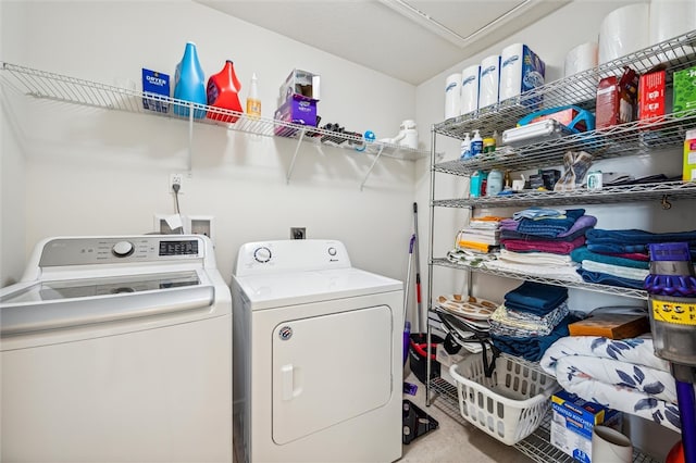 laundry room featuring washing machine and clothes dryer