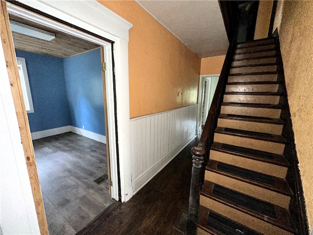 stairway featuring wood-type flooring