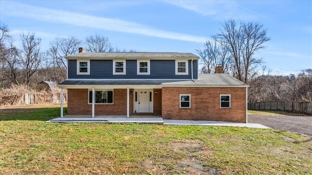 front of property featuring a patio and a front lawn