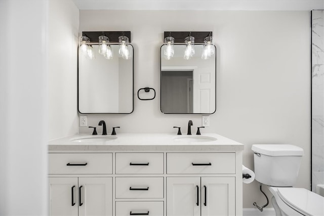 bathroom featuring walk in shower, vanity, and toilet