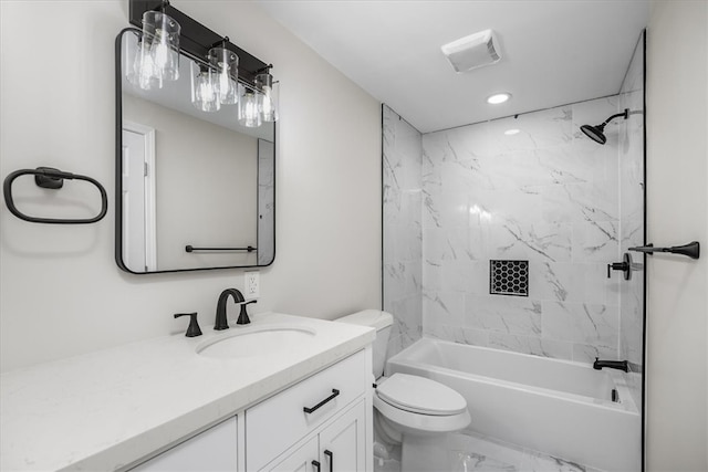 full bathroom with vanity, toilet, and tiled shower / bath