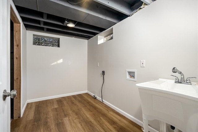 washroom featuring washer hookup and hardwood / wood-style flooring