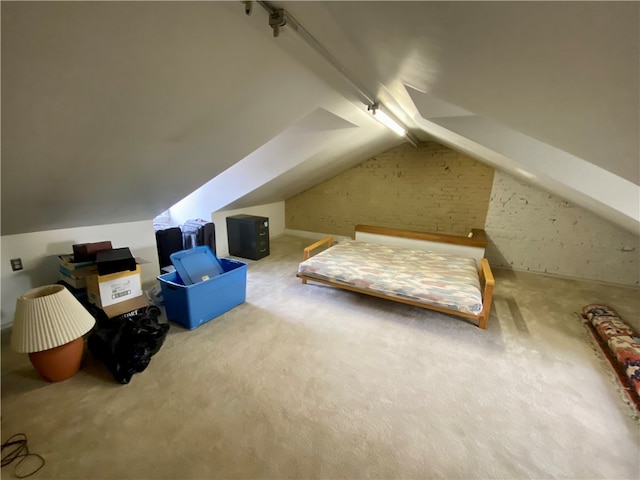 bonus room featuring lofted ceiling with beams and carpet floors