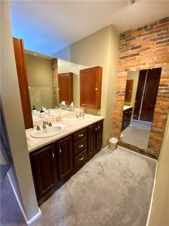 full bath featuring a sink and double vanity