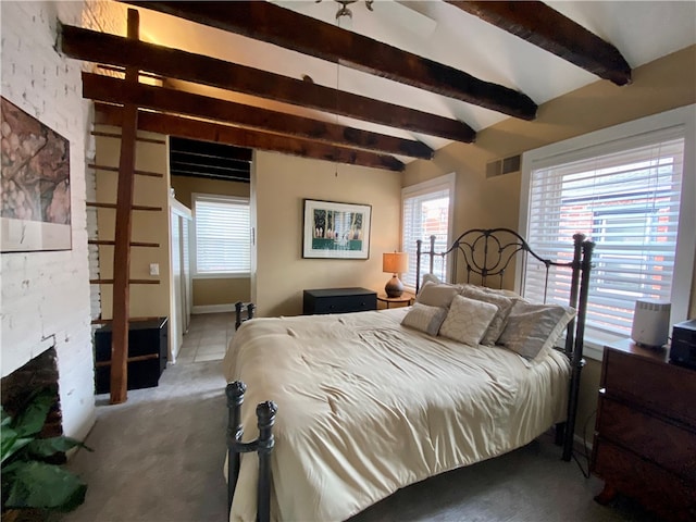 bedroom featuring light colored carpet, visible vents, beamed ceiling, and a fireplace