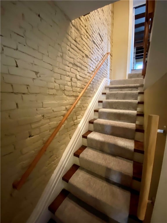 stairway with brick wall