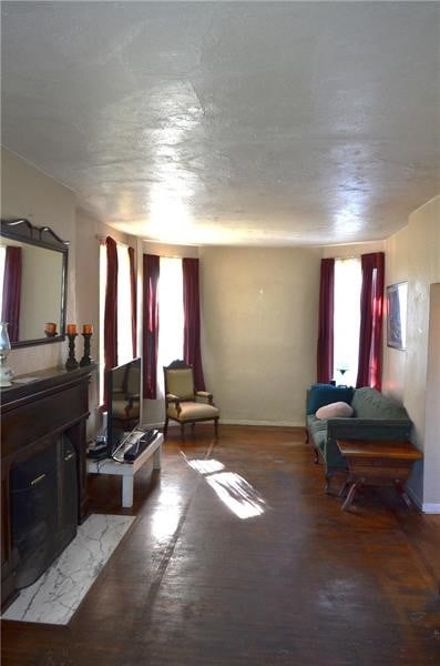 sitting room featuring plenty of natural light and a textured ceiling