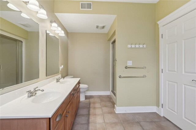 full bathroom with visible vents, a sink, and tile patterned floors