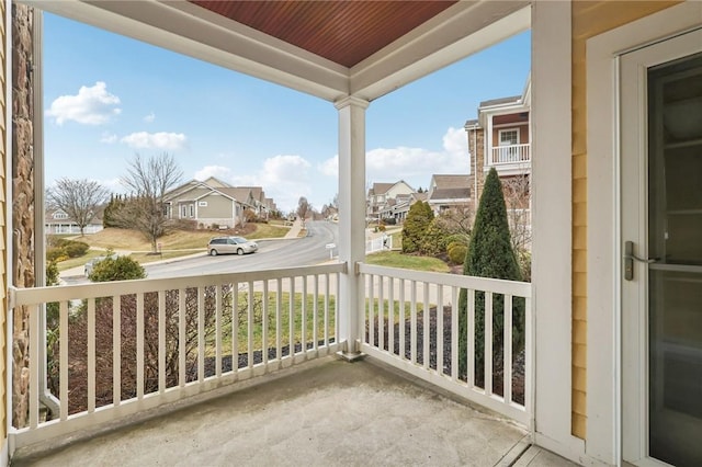 balcony featuring a porch and a residential view