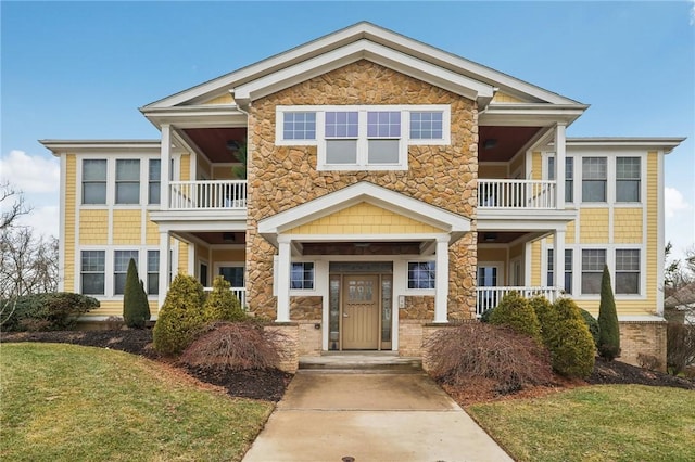 view of front of house featuring a balcony