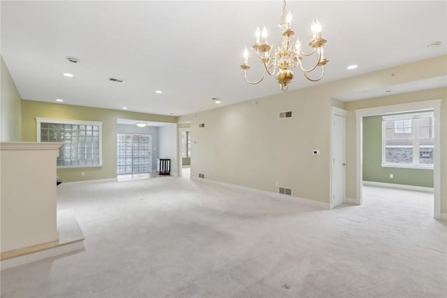 unfurnished living room with light carpet, baseboards, visible vents, and recessed lighting