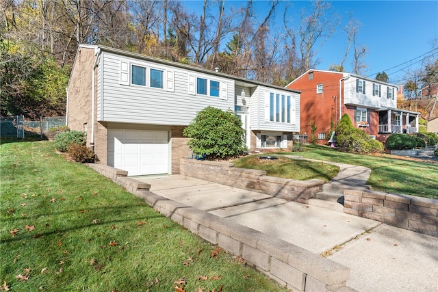 view of front of property featuring a garage and a front yard