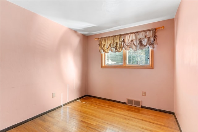 unfurnished room featuring light wood-type flooring