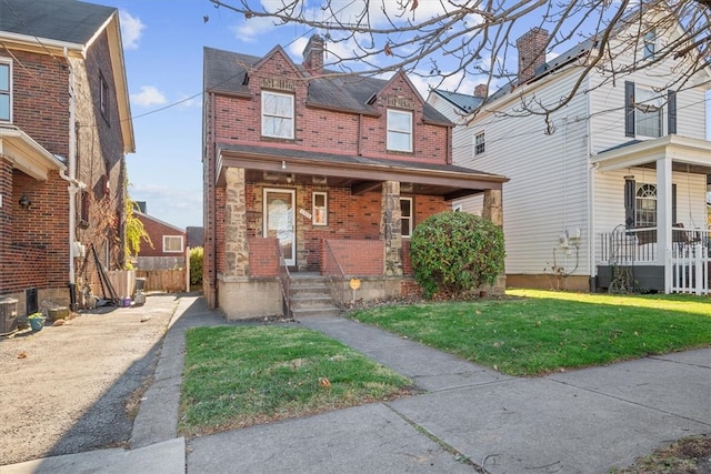 view of front of property with a front lawn and a porch