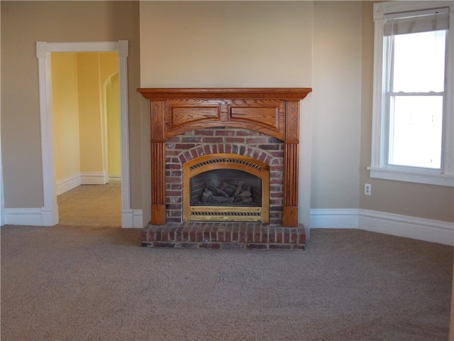 interior details featuring carpet flooring and a fireplace