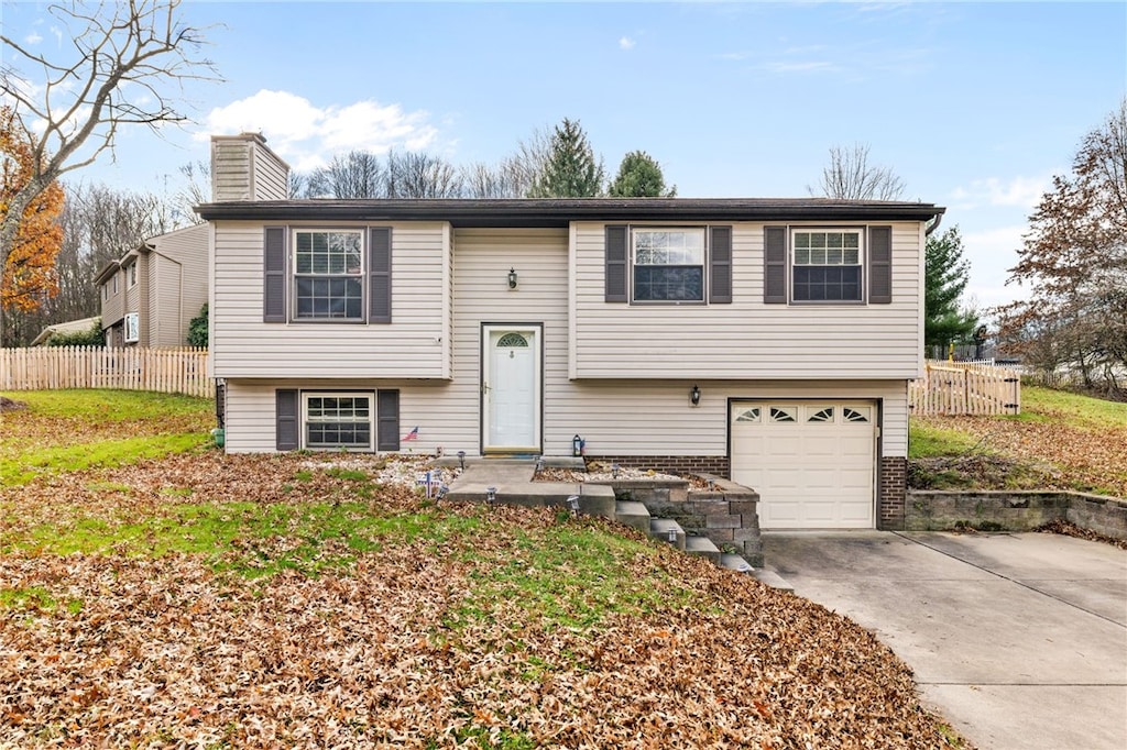 split foyer home featuring a garage