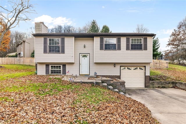 split foyer home featuring a garage