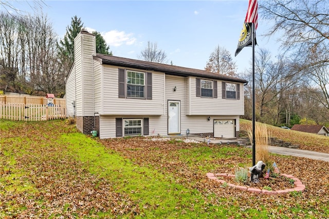 split foyer home featuring a garage