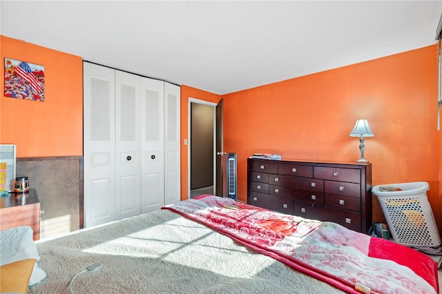 carpeted bedroom featuring a closet