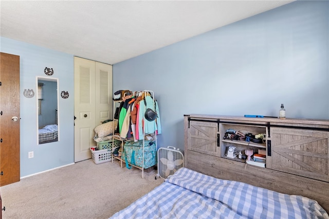 carpeted bedroom featuring a closet