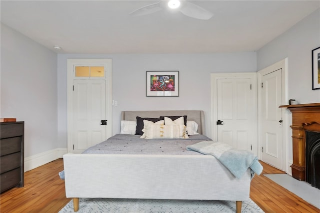 bedroom with ceiling fan and light wood-type flooring