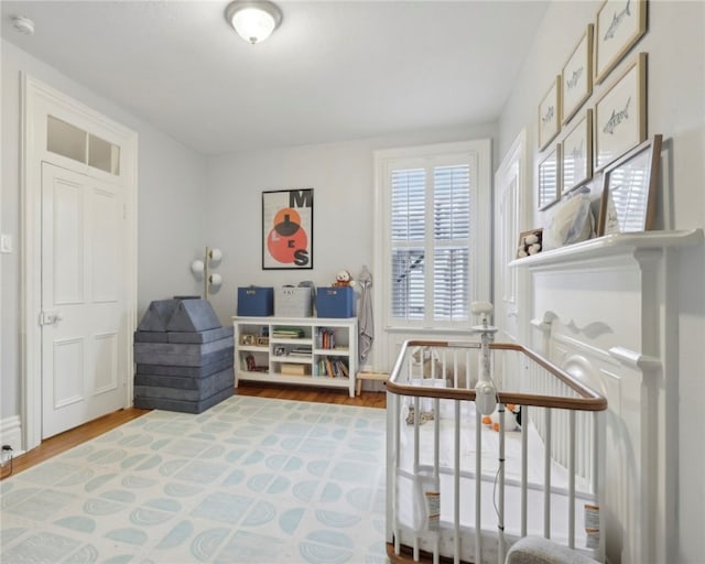 playroom with wood-type flooring