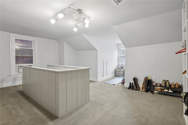 bonus room featuring light carpet and vaulted ceiling