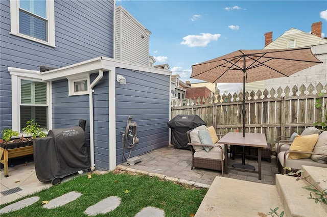 view of patio / terrace featuring outdoor lounge area and a grill