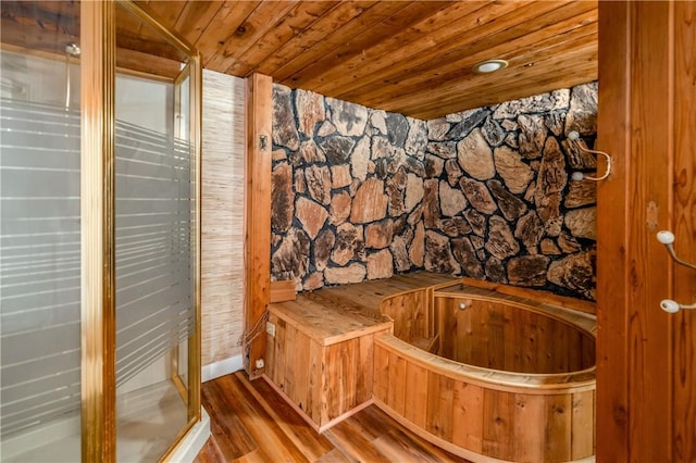 bathroom with wood-type flooring and wooden ceiling