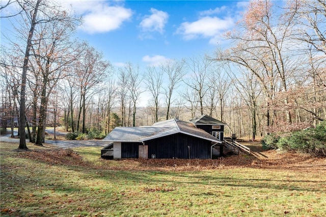 view of home's exterior with a lawn