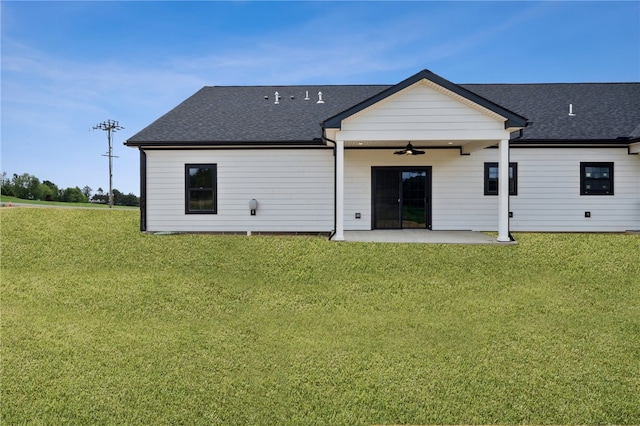 back of property featuring a patio area, a lawn, and ceiling fan