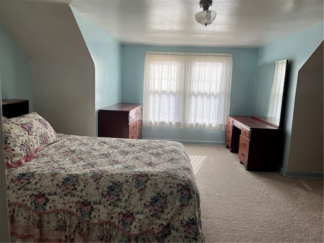 bedroom featuring light carpet