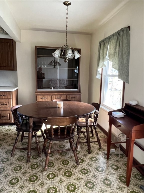 dining area featuring an inviting chandelier