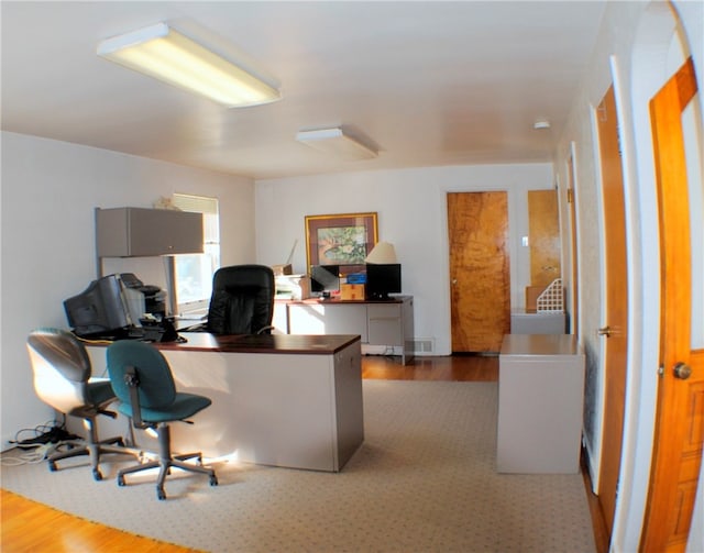 home office featuring hardwood / wood-style floors