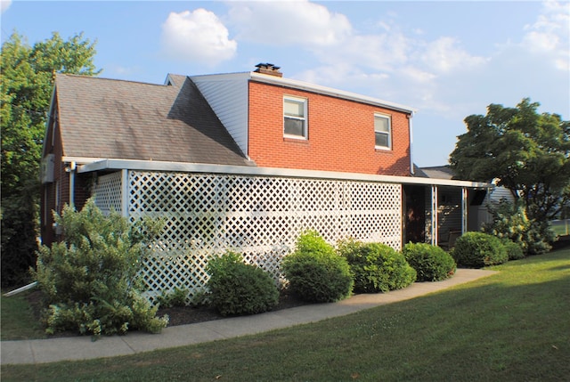 view of home's exterior featuring a lawn