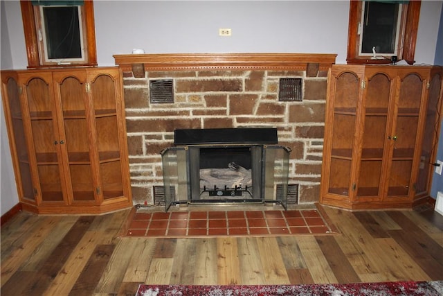 room details featuring hardwood / wood-style floors and a fireplace