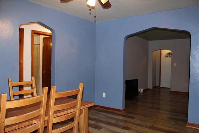 dining room featuring dark hardwood / wood-style floors and ceiling fan