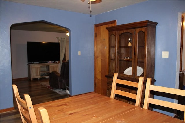 dining space with ceiling fan and hardwood / wood-style flooring