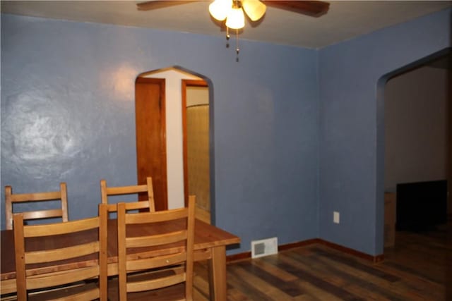 dining area featuring dark hardwood / wood-style floors and ceiling fan